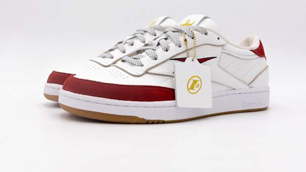 Side view of Allen Iverson's white and red Reebok sneakers.